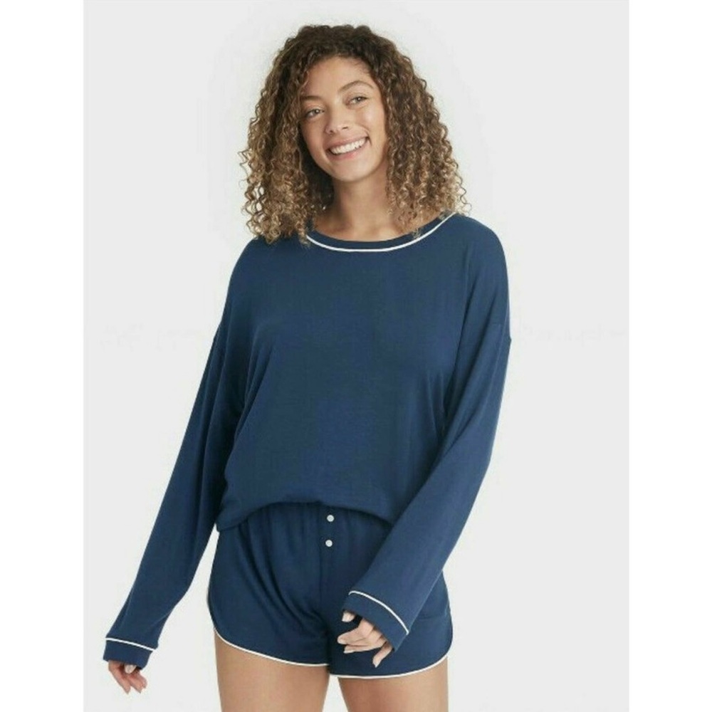 Navy blue stars above long sleeve pajama top